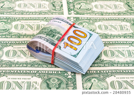 Folded dollar bills wrapped by rubber band  28480935