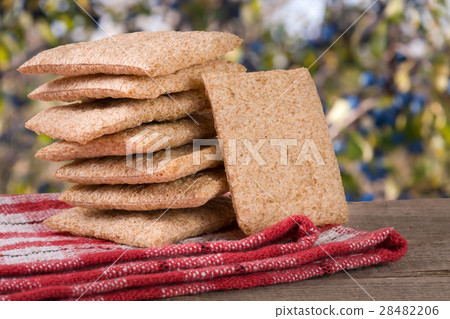 stack of crisp bread on a wooden table with stack of crisp bread on a wooden table with 28482206