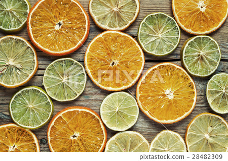 Dried orange and lemon slices on wooden table. 28482309