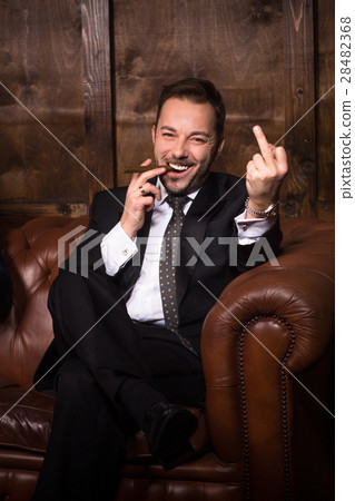 Rich businessman with cigar Rich businessman with cigar 28482368