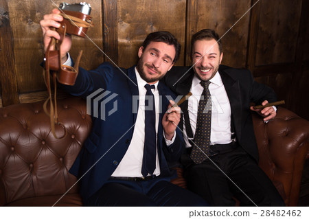 Rich businessmen with cigars 28482462