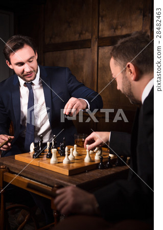 Rich businessmen playing chess Rich businessmen playing chess 28482463