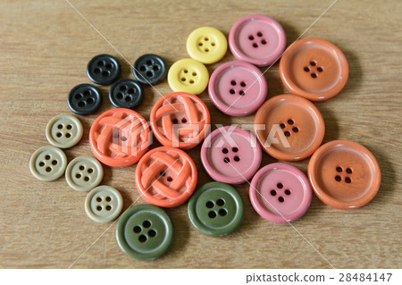 old buttons on wooden background 28484147