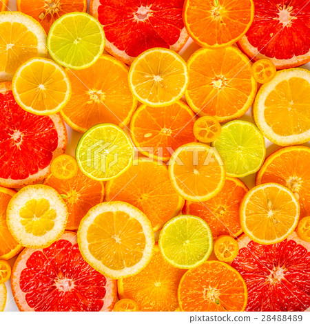 fresh sliced mixed citrus fruits like background 28488489