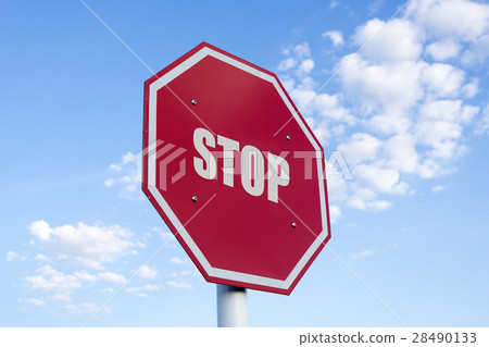 圖庫照片: the white stop text in traffic sign