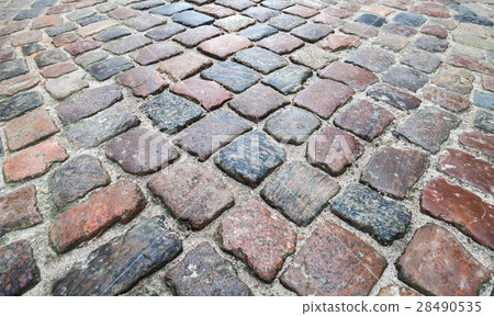 Old dark colorful shining cobblestone road 28490535