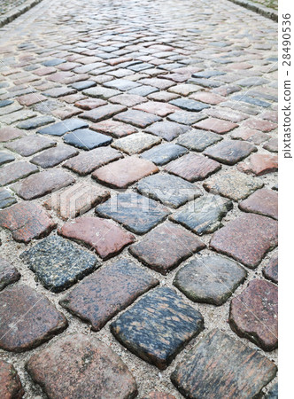 Old colorful shining cobblestone road 28490536
