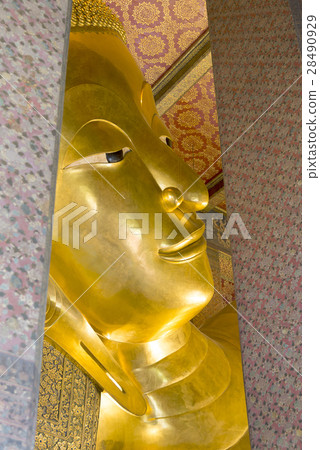 the face of reclining Buddha statute in the temple 28490929