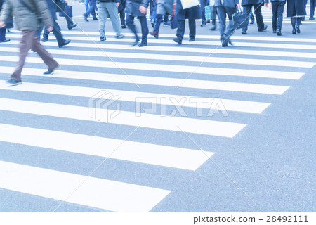 At the footsteps of people going around the intersection of the office town At the footsteps of people going around the intersection of the office town 28492111