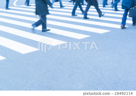 At the footsteps of people going around the intersection of the office town At the footsteps of people going around the intersection of the office town 28492114
