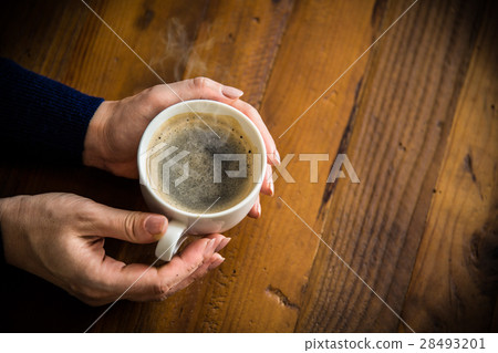 A woman with coffee 28493201
