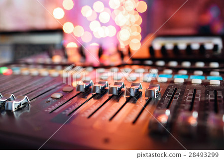 od adjusters and red buttons of a mixing console 28493299