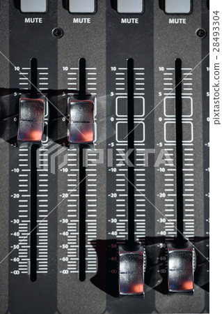 Top view od adjusters and red buttons of a mixing Top view od adjusters and red buttons of a mixing 28493304