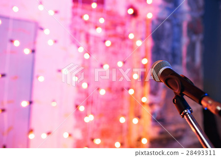 Close up of microphone in concert hall with 28493311