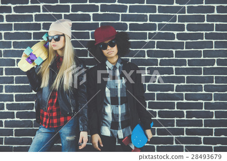 Studio lifestyle portrait of two best friends Studio lifestyle portrait of two best friends 28493679