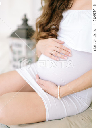 Hands of the pregnant woman on a stomach. Pregnant Hands of the pregnant woman on a stomach. Pregnant 28495646