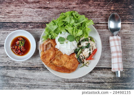 Rice topped stir-fried spicy basil with crab . Rice topped stir-fried spicy basil with crab . 28498135