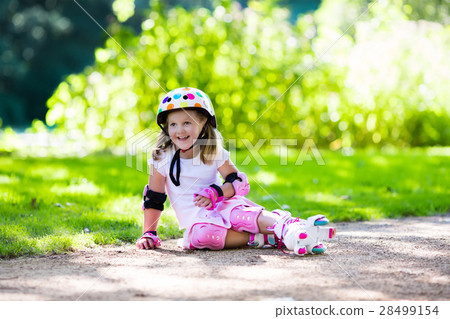 Little girl with roller skate shoes in a park 28499154