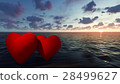 Two red hearts in the sea at sunset 28499627