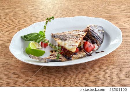 Fried fish on a white plate 28501100