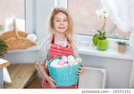 Little blonde girl holding basket with painted Little blonde girl holding basket with painted 28501332