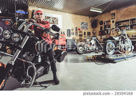 Satisfied old woman sitting on motorcycle 28504168