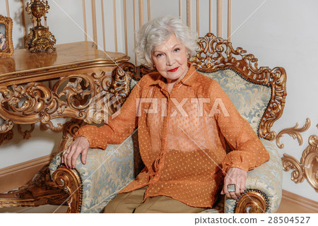 Serious mature woman gazing someone 28504527