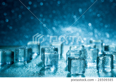 Melting ice cubes on glass table 28509385
