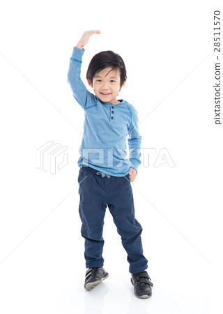 Asian Boy growing tall and measuring himself 28511570