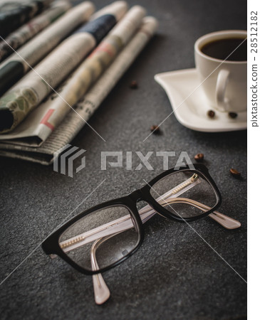 Glasses and newspaper Glasses and newspaper 28512182