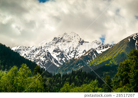 mountain peaks against the blue sky 28517207