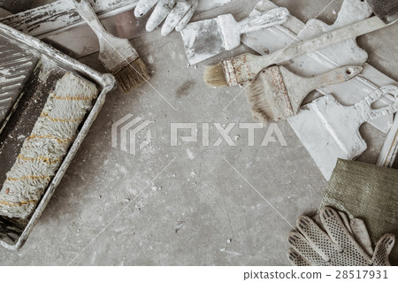 Plastering tools on cement background. 28517931