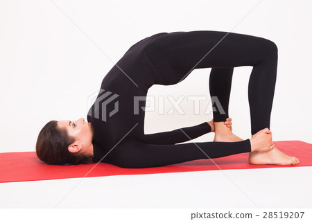 Beautiful athletic girl in black suit doing yoga Beautiful athletic girl in black suit doing yoga 28519207