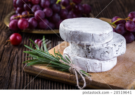 Camembert cheese with grape and branch of rosemary 28519641