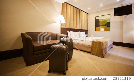 traveling bag in the hotel room 28521319