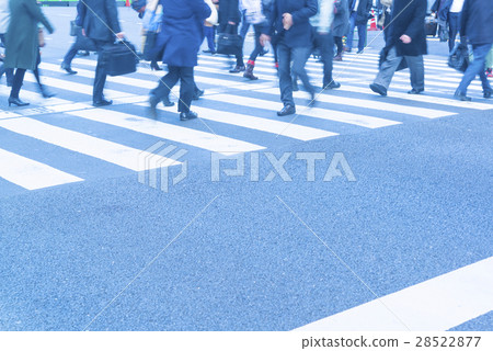 At the footsteps of people going around the intersection of the office town 28522877