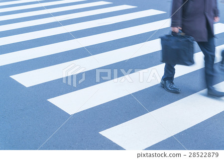 At the footsteps of people going around the intersection of the office town 28522879