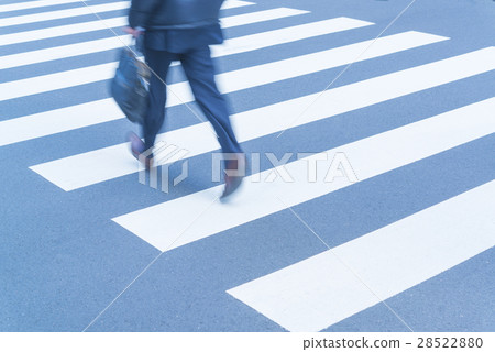 At the footsteps of people going around the intersection of the office town 28522880