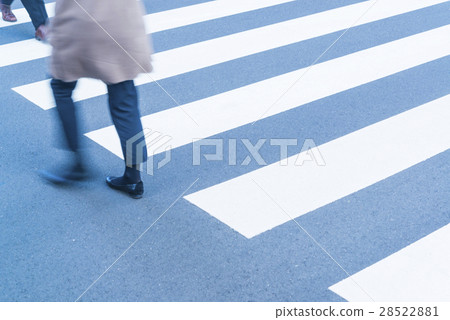 At the footsteps of people going around the intersection of the office town 28522881