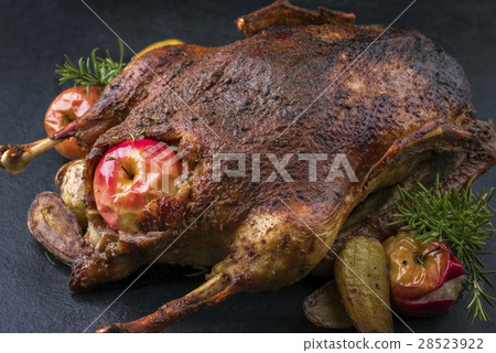 Barbecue Goose with Apples on a Slate Slab Barbecue Goose with Apples on a Slate Slab 28523922