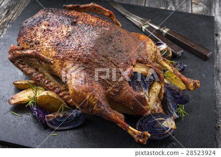 Barbecue Goose with Potatoes Blue Kraut Barbecue Goose with Potatoes Blue Kraut 28523924