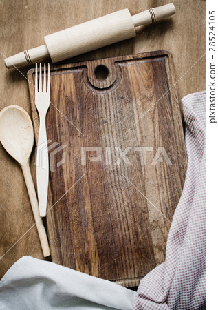 Rolling-pin with Kitchen Towel on Wooden Board. Rolling-pin with Kitchen Towel on Wooden Board. 28524105