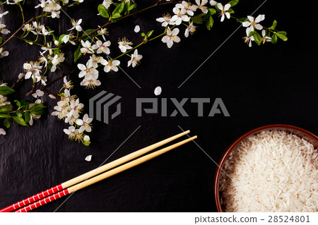 Composition with rice and chopsticks on stone 28524801