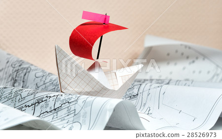 paper boat floating on the paper waves 28526973