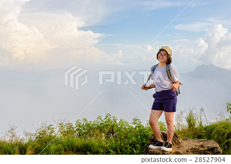 Tourist teen girl poses on mountain 28527904
