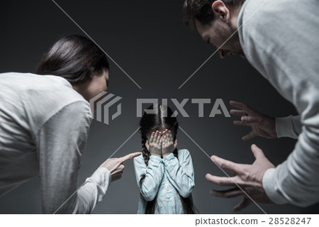 Two elderly persons shouting at little girl 28528247