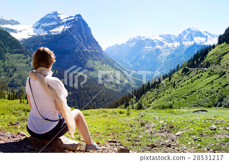 woman enjoying glacier national park 28531217