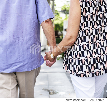 Mature people romantic holding hands Mature people romantic holding hands 28537874