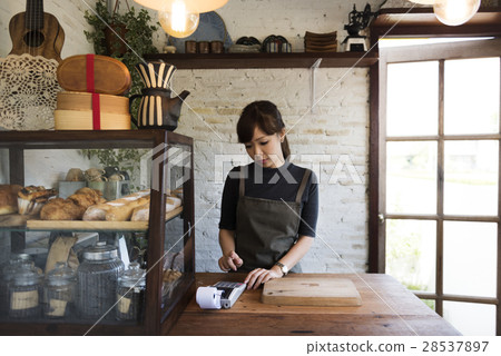 Woman managing a small bakery house 28537897
