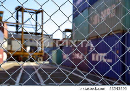 Wire mesh fence surrounding container yard Wire mesh fence surrounding container yard 28543893